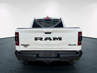 The 2022 Ram 1500 Rebel 4x4 Crew Cab 57 Box in stunning white lets you command every road with confi... (image 7)