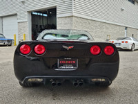 This isn’t just a car—it’s a statement. Draped in sleek black-on-black with polished chrome wheels t... (image 6)