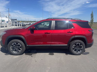 The 2025 Chevrolet Equinox ACTIV, dressed in a bold Radiant Red exterior with a distinctive Maple Su... (image 4)