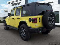 Turn heads and conquer any terrain in this vibrant 2024 Jeep Wrangler Sahara, boasting a striking Hi... (image 4)