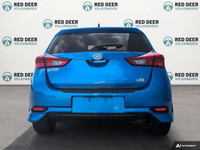 Experience the vibrant blue 2018 Toyota Corolla iM, a front-wheel-drive sedan designed for precision... (image 5)
