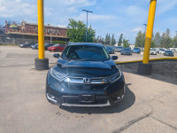 Summary The Touring represents the pinnacle of the 2019 CR-V lineup, offering a refined blend of per... (image 5)