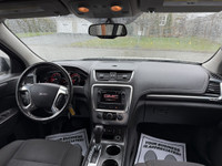 This 2014 GMC Acadia SLE-2 is a spacious and reliable SUV with a sleek white exterior and a comforta... (image 9)