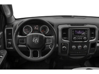 The 2021 Ram 1500 Classic Express 4x4 Crew Cab 57 Box is a bold black truck with an impressive 44 dr... (image 7)