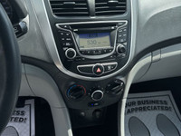This 2014 Hyundai Accent Sedan is a reliable and stylish choice! With its sleek white exterior and c... (image 8)