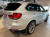 Our 2015 BMW X5 xDrive35i gives you the comfort of an SUV and the spirit of a sports car in Silver M... (image 4)