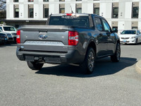 This 2022 Ford Maverick XL has an Carbonized Grey Exterior and Black Onyx Med Interior with seating... (image 7)