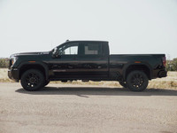 The 2025 GMC Sierra 3500 AT4 stands tall as a powerhouse of rugged sophistication, engineered to tak... (image 4)