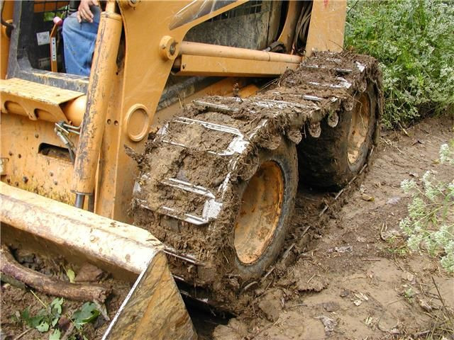 * RUBBER AND STEEL OVER THE TIRE TRACK FOR SKID STEER LOADERS * in Heavy Equipment in Regina