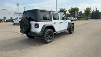 This 2025 JEEP WRANGLER 4-DOOR SPORT has the following options Cloth Low-Back Bucket Seats, Uconnect... (image 8)