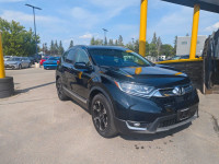 Summary The Touring represents the pinnacle of the 2019 CR-V lineup, offering a refined blend of per... (image 6)