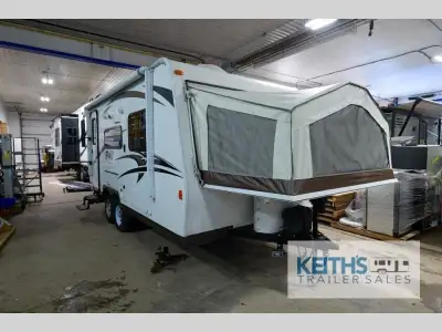 The Rockwood Roo 19 expandable by Forest River welcomes you with front and rear queen tent beds. Upo...