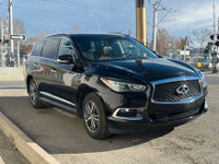 The 2016 INFINITI QX60 AWD offers a spacious and upscale cabin with leather-appointed seating, heate... (image 4)