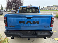The 2022 Ram 1500 Rebel in Hydro Blue Pearl stands out with bold styling and off-road capability. Eq... (image 6)
