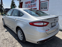TITANIUM | AWD | LEATHER HEATED AND COOLED SEATS | SUNROOF This 2016 Ford Fusion Titanium offers a r... (image 7)