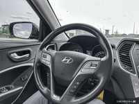 The 2017 Hyundai Santa Fe Platinum in Graphite offers all-wheel drive with a panoramic sunroof, heat... (image 9)