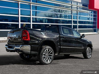 This Ram 1500 has a trusty Twin Turbo Premium Unleaded I-6 3.0 L/183 engine powering this Automatic... (image 6)
