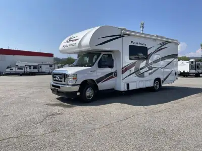 Thor Motor Coach Four Winds Class C gas motorhome 24F highlights: Full-Wall Slide Two Closets Cab Ov...