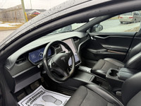 This sleek 2018 Tesla Model S in black is a stylish and eco-friendly choice for your next ride. With... (image 5)