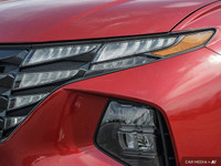 Command attention with the 2023 Hyundai Tucson Preferred, a crimson red SUV that seamlessly blends s... (image 9)