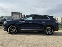 Under the glistening Rhapsody Blue exterior, the 2019 Lincoln Nautilus Reserve stands as a testament... (image 3)