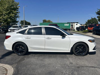 This 2022 Honda Civic Sedan Sport shines in Platinum White Pearl, boasting a sporty profile and a su... (image 3)