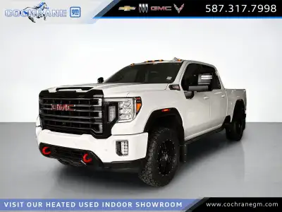Drive our used Diesel powered 2021 GMC Sierra 2500 AT4 Crew Cab standard box 4X4 in Summit White and...