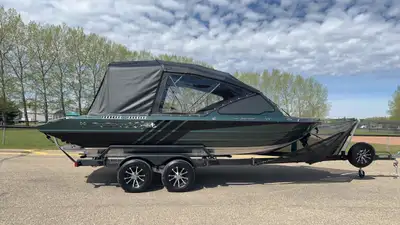 Brand new, fully loaded. 8 deg hull, full width UHMW bottom, bimini top travel tarp/windshield cover...