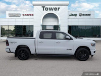 Unleash the power of the 2023 Ram 1500 Sport Crew Cab. This head-turning Bright White truck boasts a... (image 7)