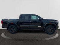 This 2025 GMC Canyon in Onyx Black is equipped with 4WD and Turbocharged Gas I4 2.7L/ engine. The GM... (image 5)