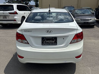 This 2014 Hyundai Accent Sedan is a reliable and stylish choice! With its sleek white exterior and c... (image 4)