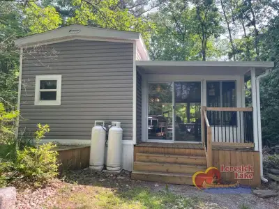 2021 Kropf luxury park model on site 45. Located in a quiet lot overlooking the forest but close to...