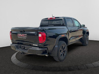 This 2025 GMC Canyon in Onyx Black is equipped with 4WD and Turbocharged Gas I4 2.7L/ engine. The GM... (image 4)
