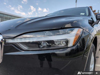 The 2021 Volvo XC60 T5 AWD Momentum is a sophisticated black SUV that offers an impeccable balance o... (image 8)