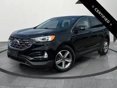 Up for sale is a well-maintained 2019 Ford Edge SEL, featuring a sleek black exterior and a rare tan...