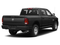 The 2021 Ram 1500 Classic Express 4x4 Crew Cab 57 Box is a bold black truck with an impressive 44 dr... (image 2)