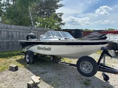 2014 Mirrocraft 1628 Holiday power matched with a Mercury 40 HP outboard engine and matching trailer...