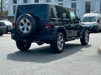 This 2018 Jeep Wrangler Sahara has a Black Exterior and Black Interior with seating for 5. Equipped... (image 6)