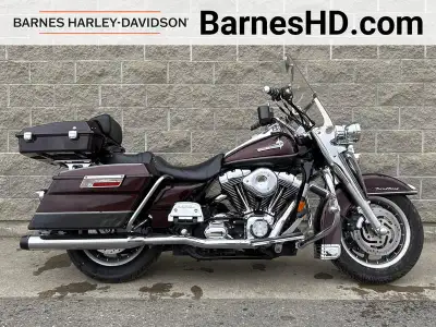 Revving up since 2005, I'm a cherry red Harley-Davidson FLHRI Road King with a sleek design that tur...