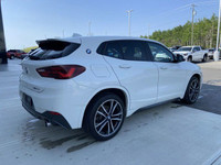 Unveil the allure of the 2022 BMW X2 xDrive28i, a summit of automotive craftsmanship adorned in a st... (image 8)