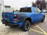 The 2022 Ram 1500 Rebel in Hydro Blue Pearl stands out with bold styling and off-road capability. Eq... (image 7)