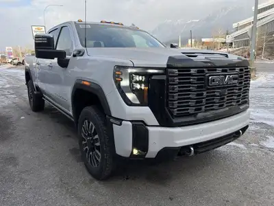 The 2025 GMC Sierra 3500HD Denali Ultimate in White Frost is a luxurious and powerful heavy-duty tru...