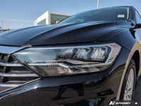 The pre-owned *2019 Volkswagen Jetta Comfortline* is a stylish and practical sedan built for drivers... (image 8)