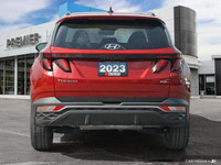 Command attention with the 2023 Hyundai Tucson Preferred, a crimson red SUV that seamlessly blends s... (image 4)