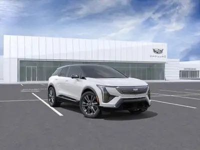 Experience the future of driving with the 2025 Cadillac OPTIQ Sport. This stunning white SUV combine...