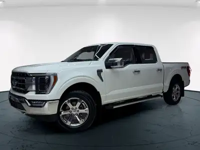 The 2021 Ford F-150 Lariat, clad in a stunning white coat and equipped with a robust 4x4 drivetrain,...