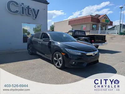The 2016 Honda Civic Touring (VIN: 2HGFC1F9XGH111613) is a refined compact sedan that delivers a str...
