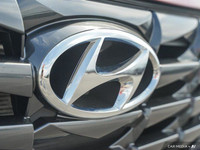 Command attention with the 2023 Hyundai Tucson Preferred, a crimson red SUV that seamlessly blends s... (image 8)