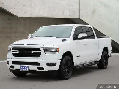 This Ram 1500 Sport comes equipped with Power Adjustable Pedals, Back Up Camera, Leather, Navigation...