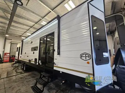 Forest River Wildwood Lodge destination trailer 40FDEN highlights: Two Slides King Bed with Versa-Ti...
